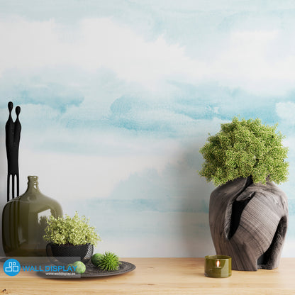 Abstract clouds wall mural in soft blue watercolor style for bedroom, nursery, and kids room wallpaper.