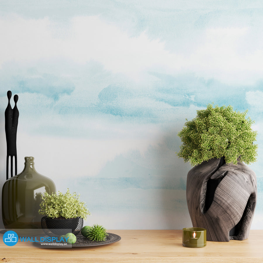 Abstract clouds wall mural in soft blue watercolor style for bedroom, nursery, and kids room wallpaper.
