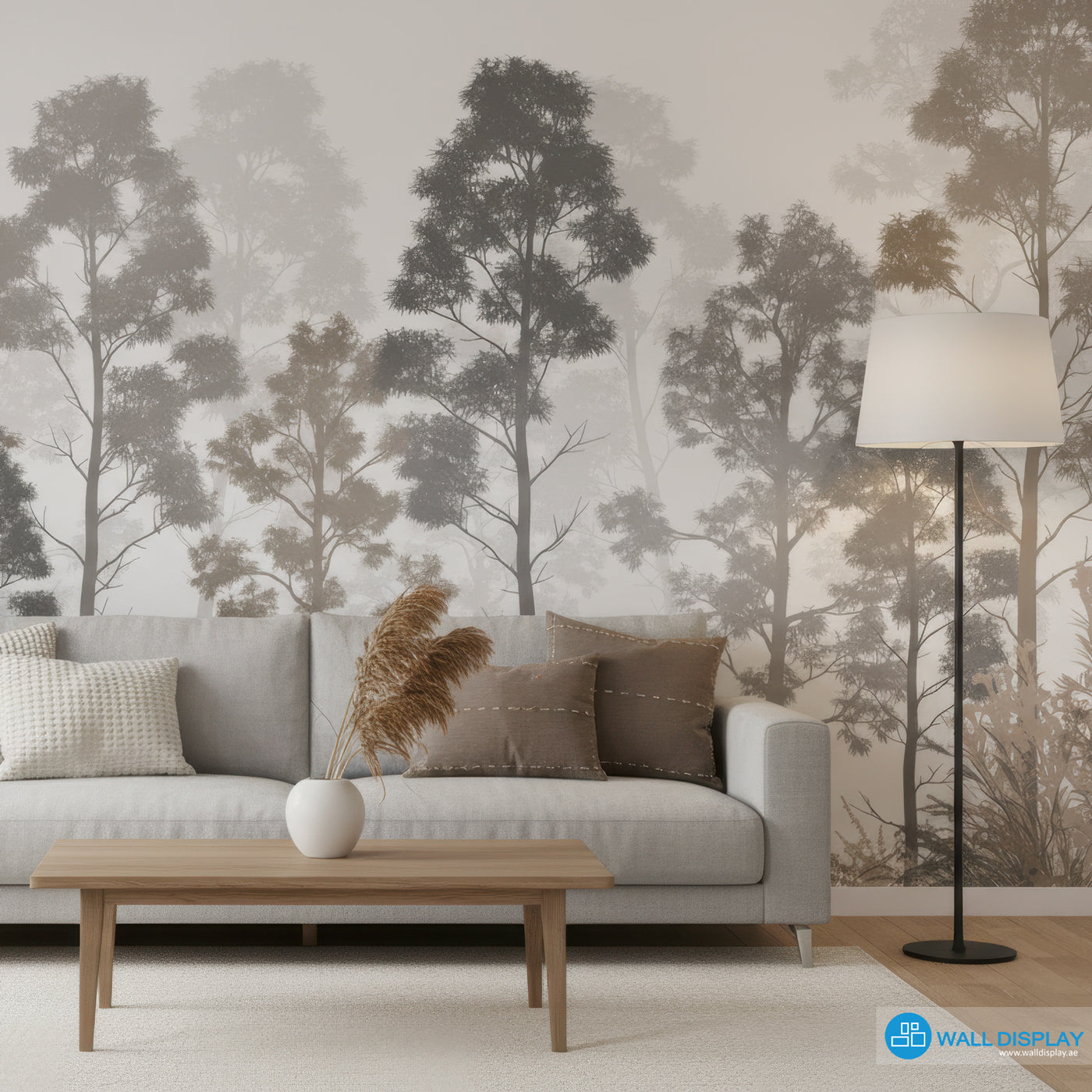 Living room with a gray sofa, wooden coffee table, and forest wallpaper.