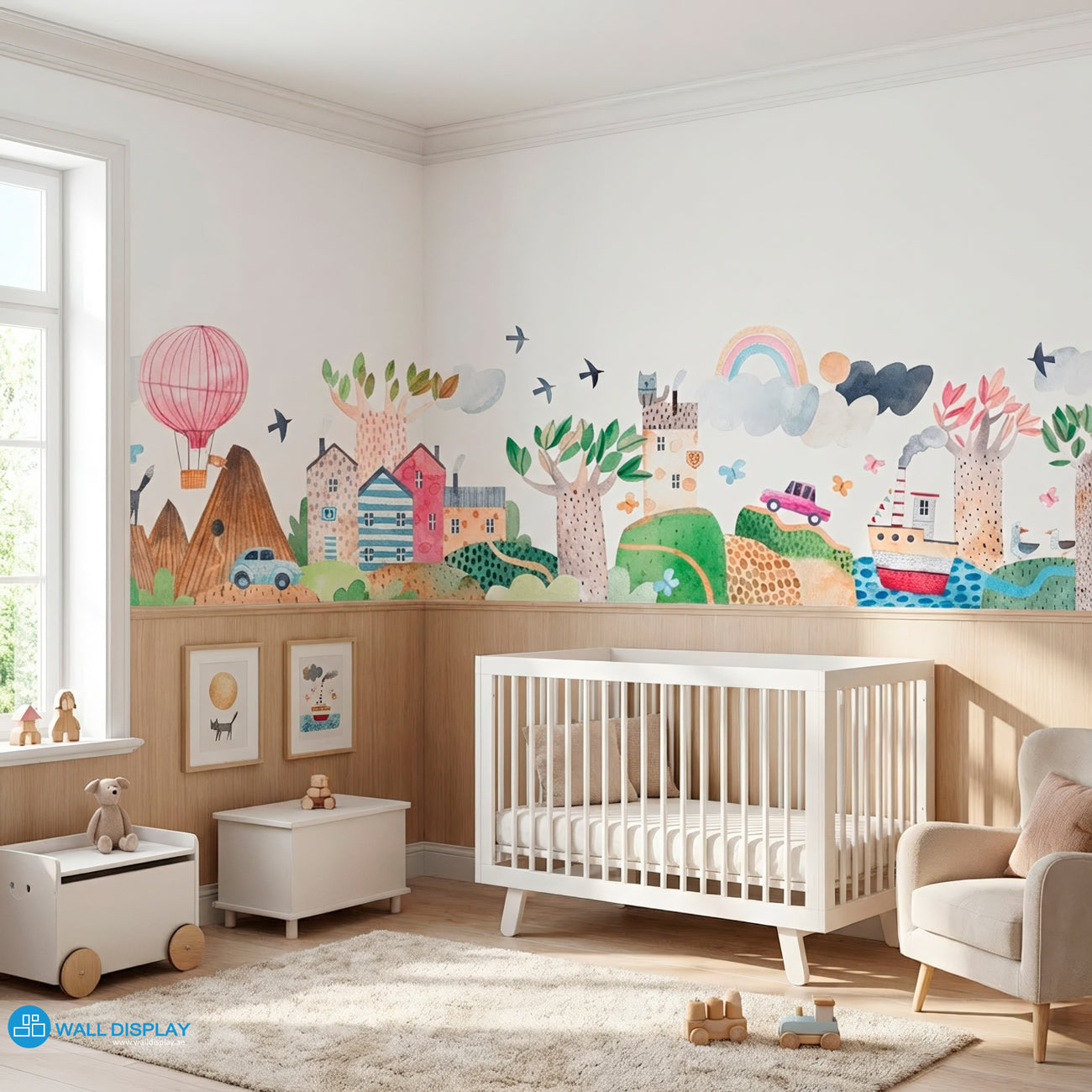 Hills Village Adventure Nursery Wallpaper with pastel watercolor houses, rolling hills, trees, rainbow, balloon, and playful village details