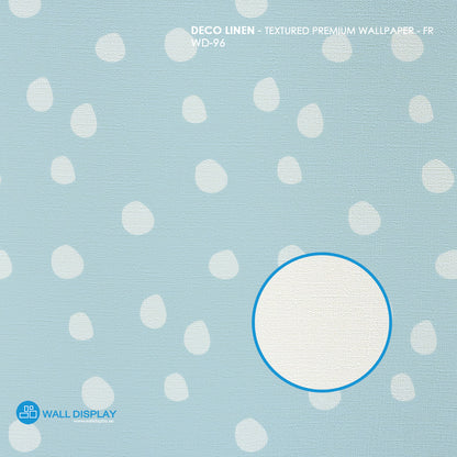 Soft Pebble Dots kids wallpaper with white hand-painted pebble dots on a pastel blue background for nursery and playroom walls.