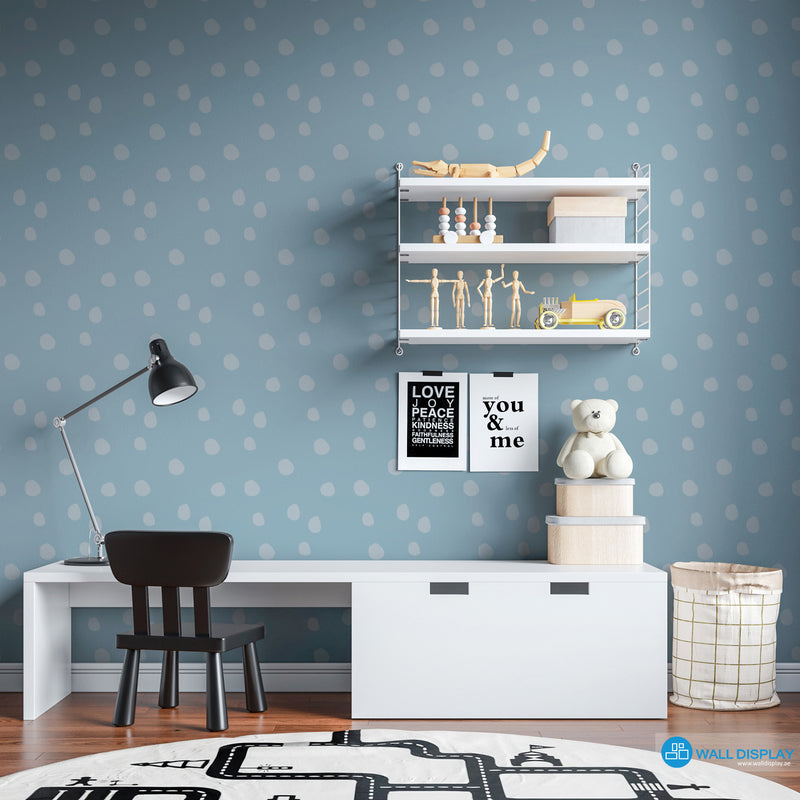 Soft Pebble Dots kids wallpaper with white hand-painted pebble dots on a pastel blue background for nursery and playroom walls.