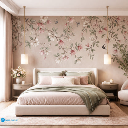 Songbirds in Bloom floral wall mural with magnolia blossoms, flying birds, sage green leaves, and soft blush plaster background.