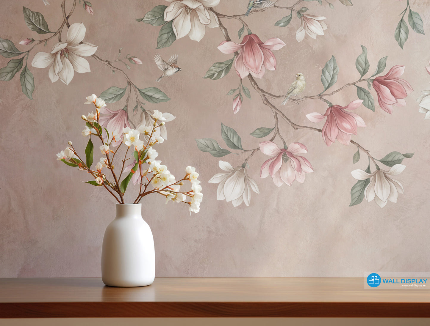 Songbirds in Bloom floral wall mural with magnolia blossoms, flying birds, sage green leaves, and soft blush plaster background.