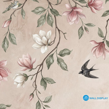 Songbirds in Bloom floral wall mural with magnolia blossoms, flying birds, sage green leaves, and soft blush plaster background.