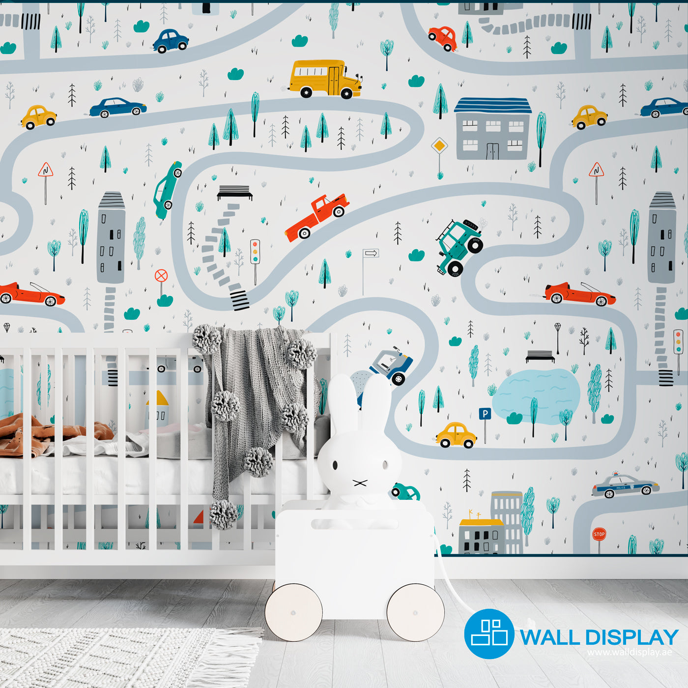Vroom Zoom kids wallpaper with illustrated roads, cars, buses, trucks, houses, trees, and traffic signs for nursery, playroom, and children’s room walls.