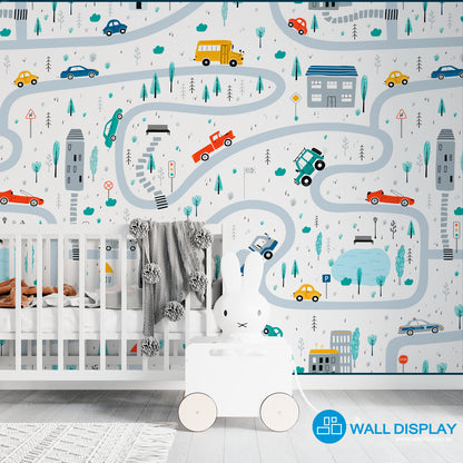 Vroom Zoom kids wallpaper with illustrated roads, cars, buses, trucks, houses, trees, and traffic signs for nursery, playroom, and children’s room walls.